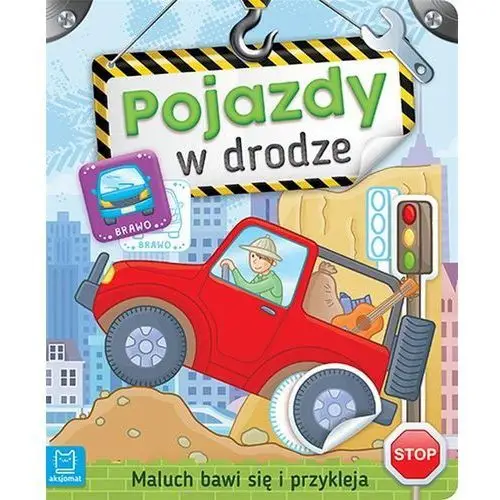 Maluch bawi się i przykleja pojazdy w drodze - praca zbiorowa Aksjomat